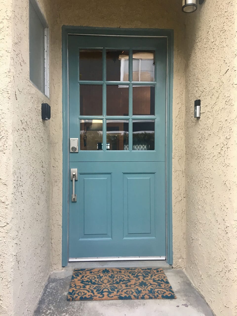 Sea blue Dutch door that opens to let in coastal breeze