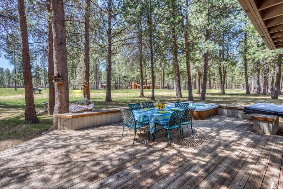Expansive deck overlooking the fairway—morning coffee or evening drinks with a view.
