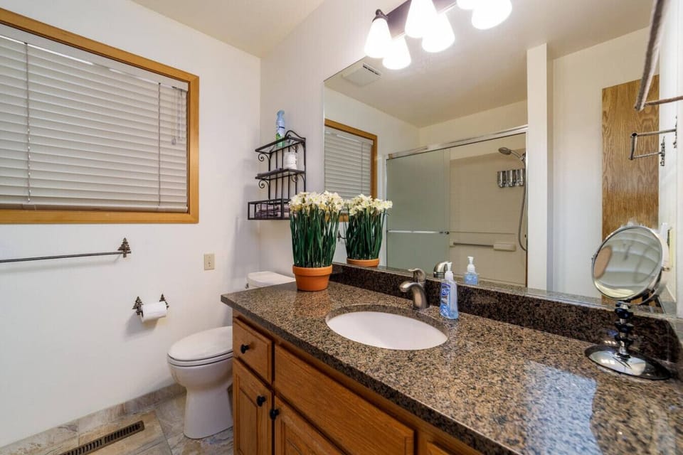 Clean, spacious main-floor bathroom conveniently located near both king bedrooms.