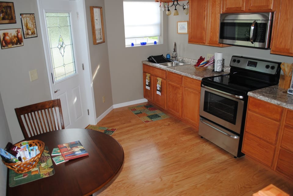 Fully stocked kitchen with breakfast table.