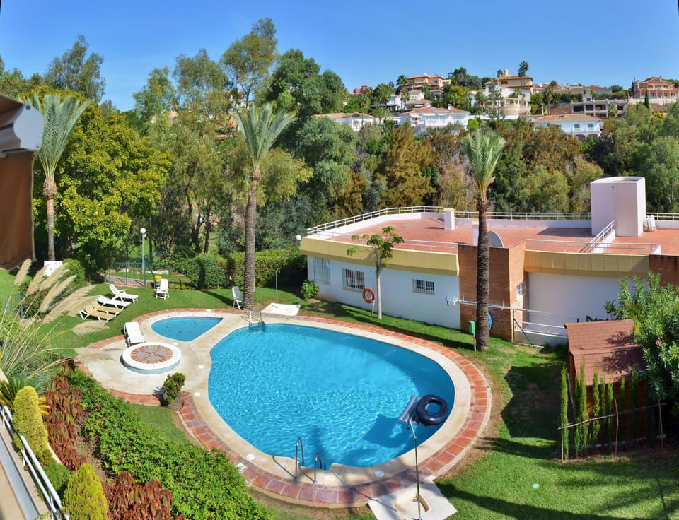 Our Penthouse on the left side with the swimming pool behind