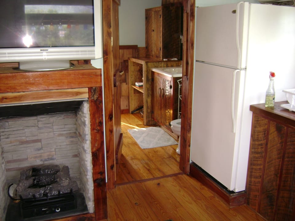 Propane fireplace, looking from kitchen into the bathroom.