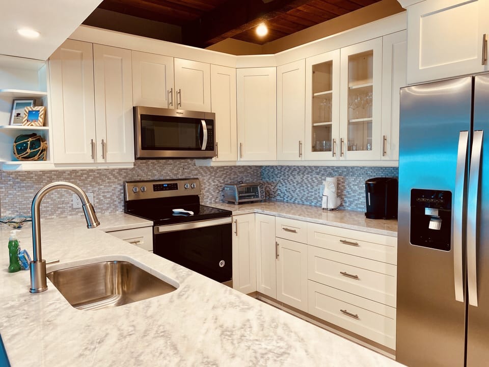 Totally remodeled kitchen with new cabinets, granite, SS appliances