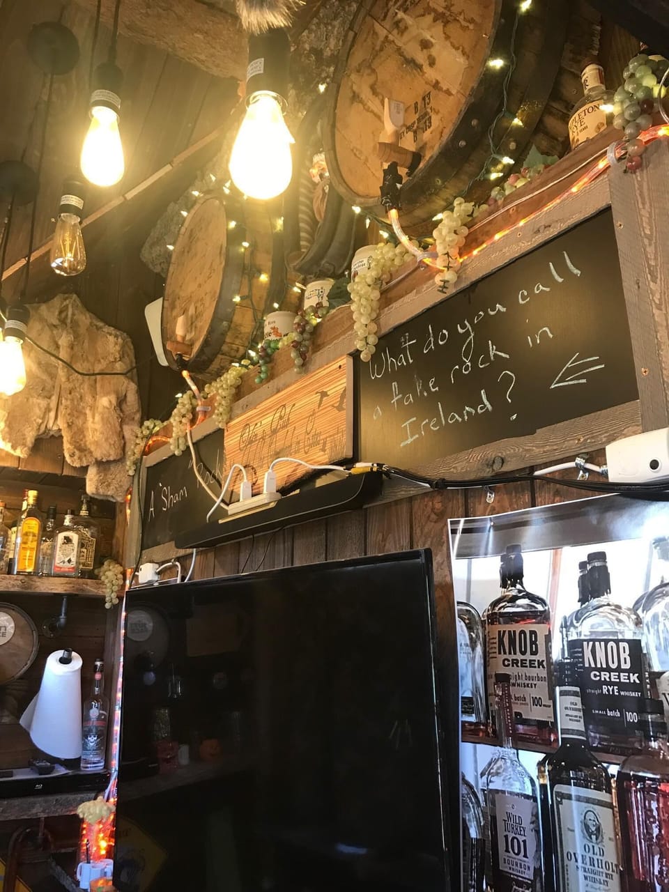 Inside the Outside Bar..55” TV w/cable, Decorations, Stools, Window Seat, etc.