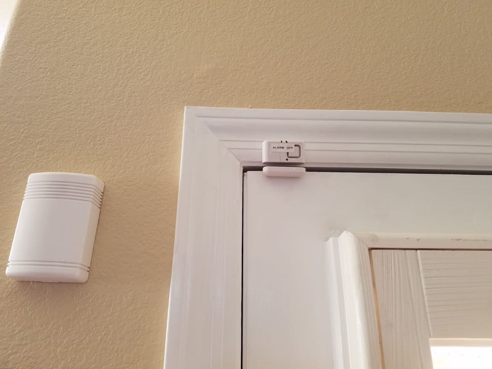 Alarm on door and raised door knob are 2 pool barriers to keep little ones safe.