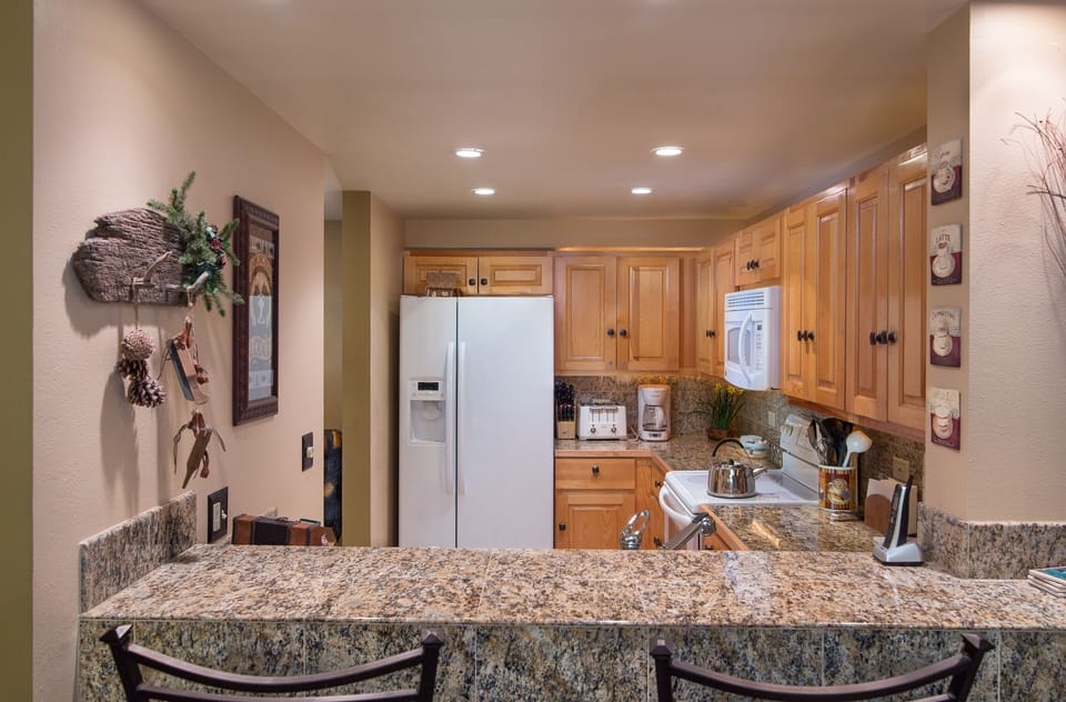 Share the joy of cooking with others seated at the bar area