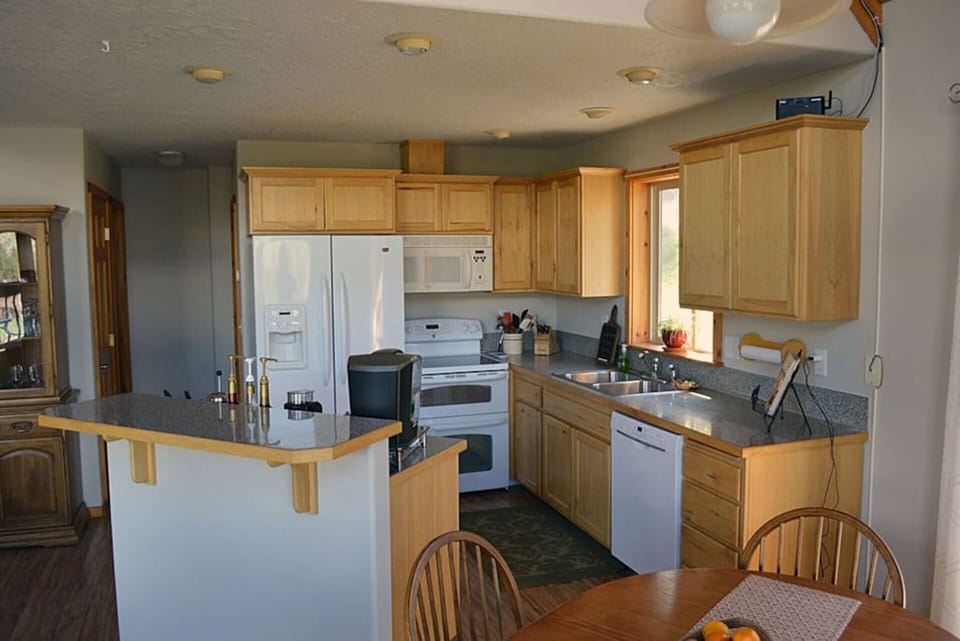 Kitchen with double oven, large refrigerator and all the tools to whip up a meal