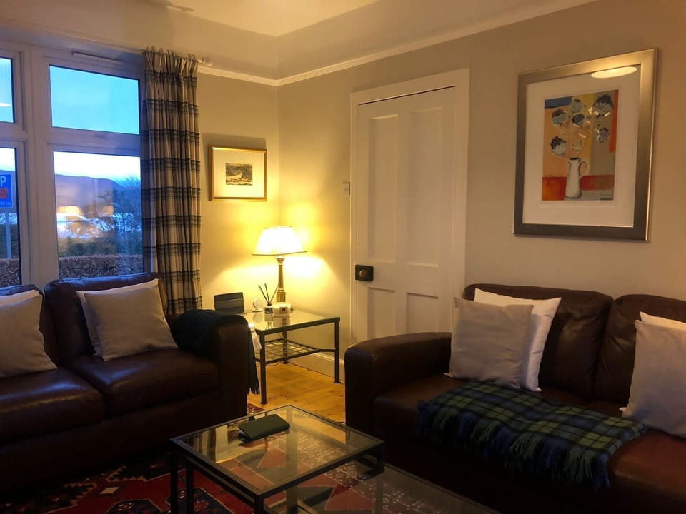 Cosy sitting room with wood burning stove 