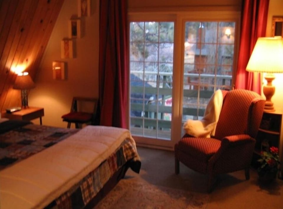 The master bedroom contains a large King bed, and overlooks the back deck & spa.