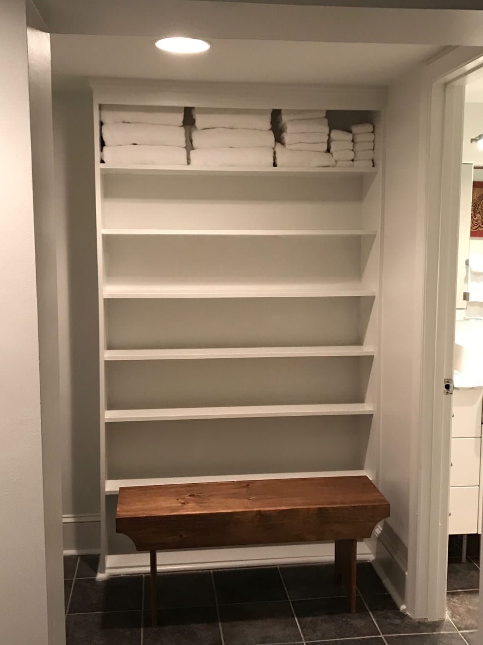 Fold out a large suitcase and put your things on these convenient shelves. 