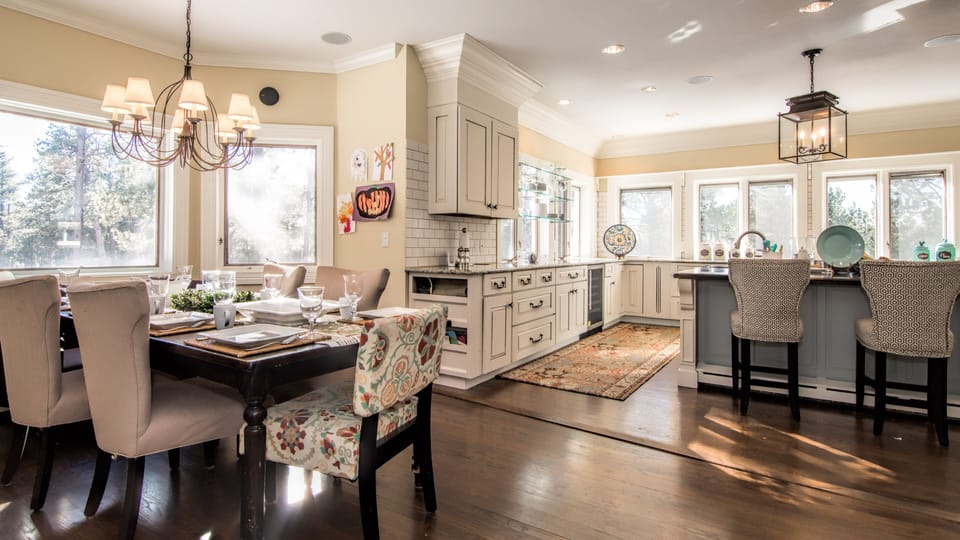 Kitchen dining and large bar leads to expansive treks deck.