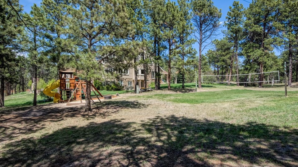 Volleyball or badminton court on side of house.