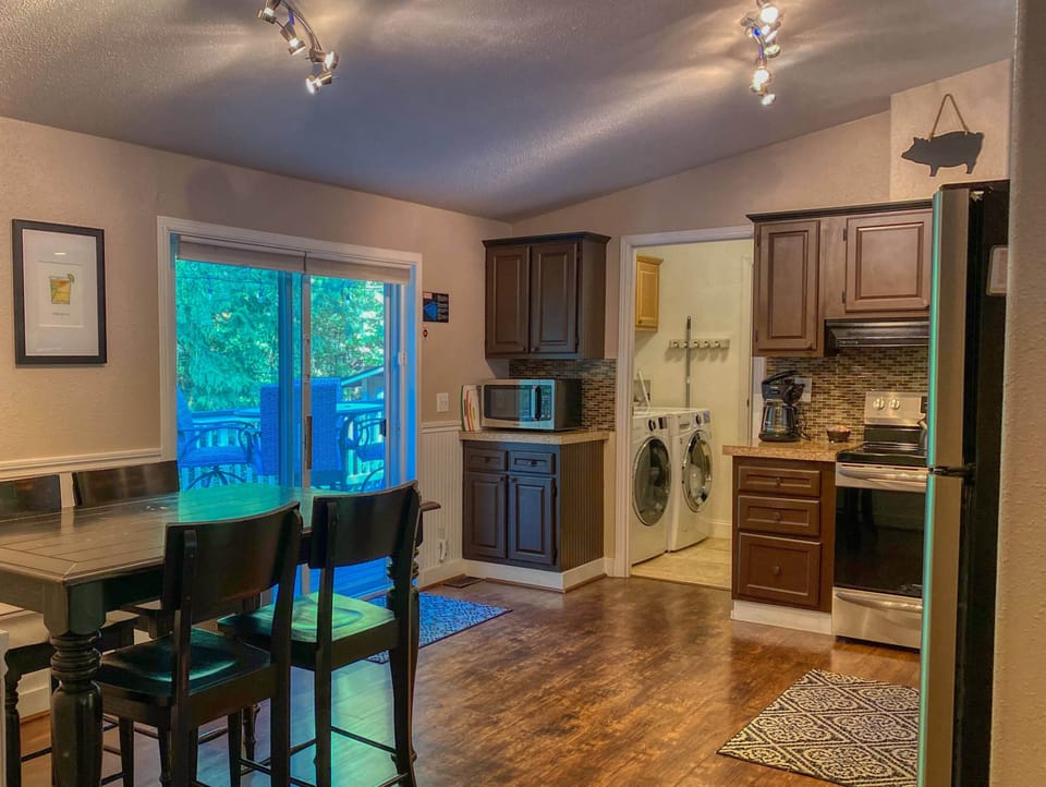 Kitchen and dining with sliders to the back deck