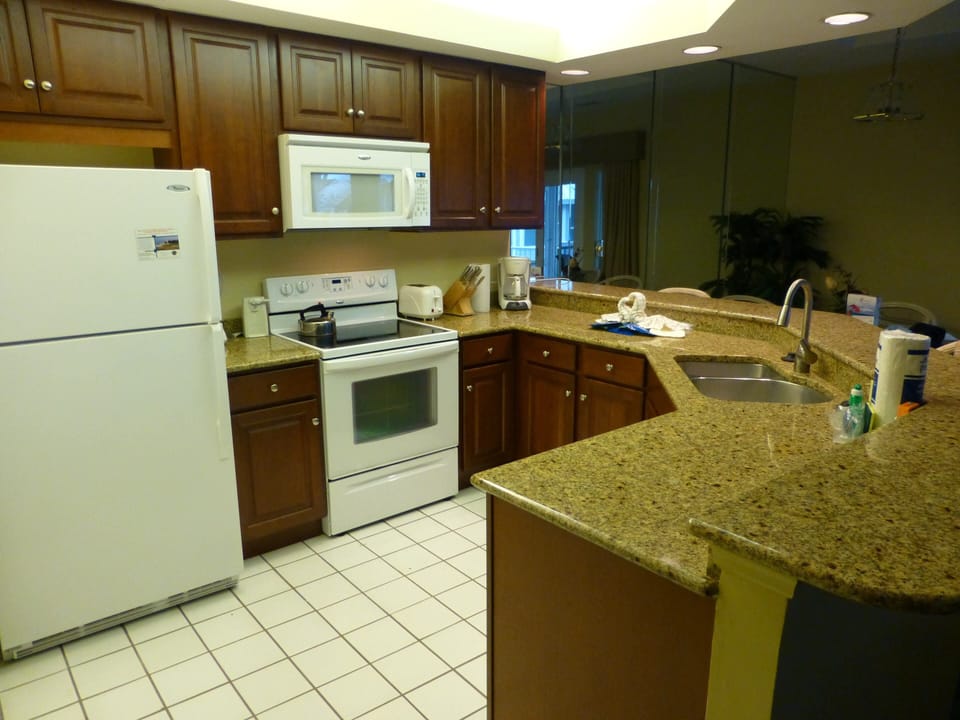 Beautiful cherry cabinets and granite countertops in updated kitchen.