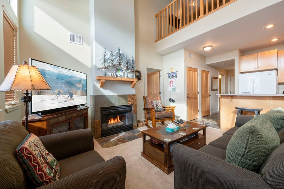 Cozy living area with fireplace and TV