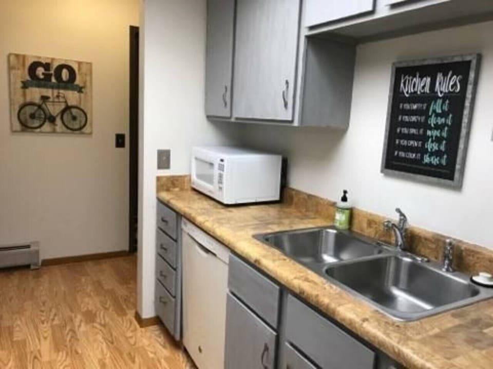 Kitchen w/appliances, cook/bakeware, place settings, microwave, and coffee machine