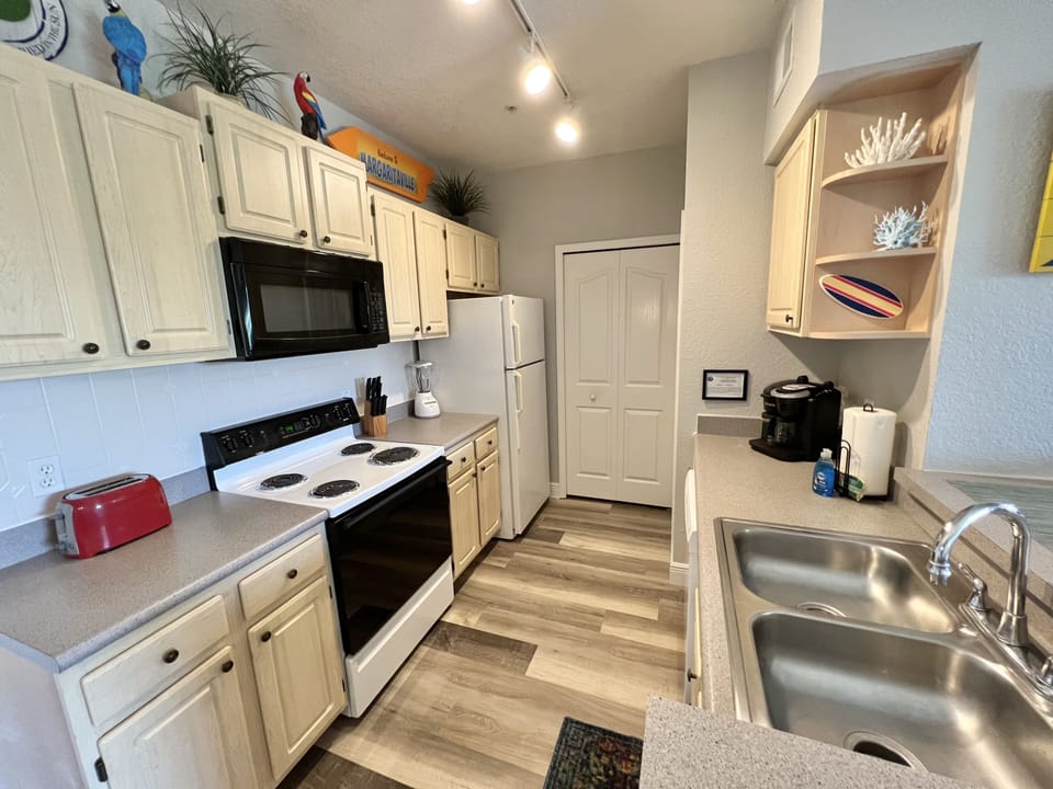 Microwave, Stove, Coffee Maker, Toaster, Pots, Pans and so much more.....