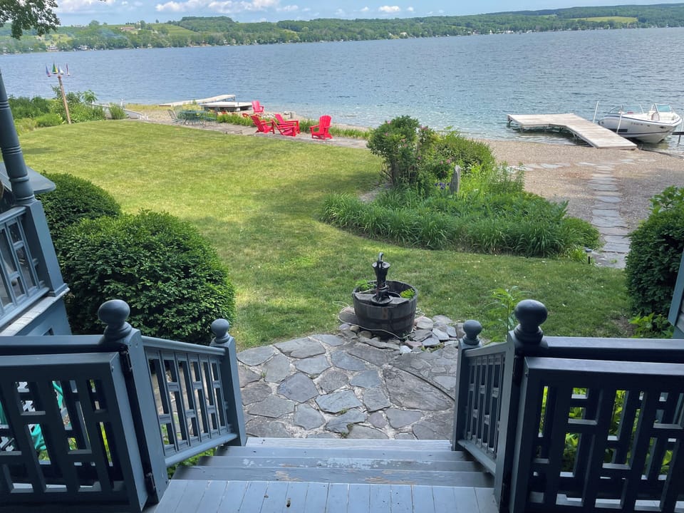 Easy access from the covered porch to the lawn and water