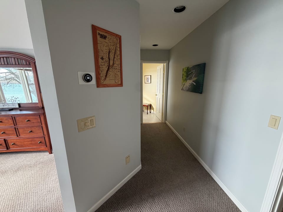 Master bedroom with queen bed and half bathroom attached