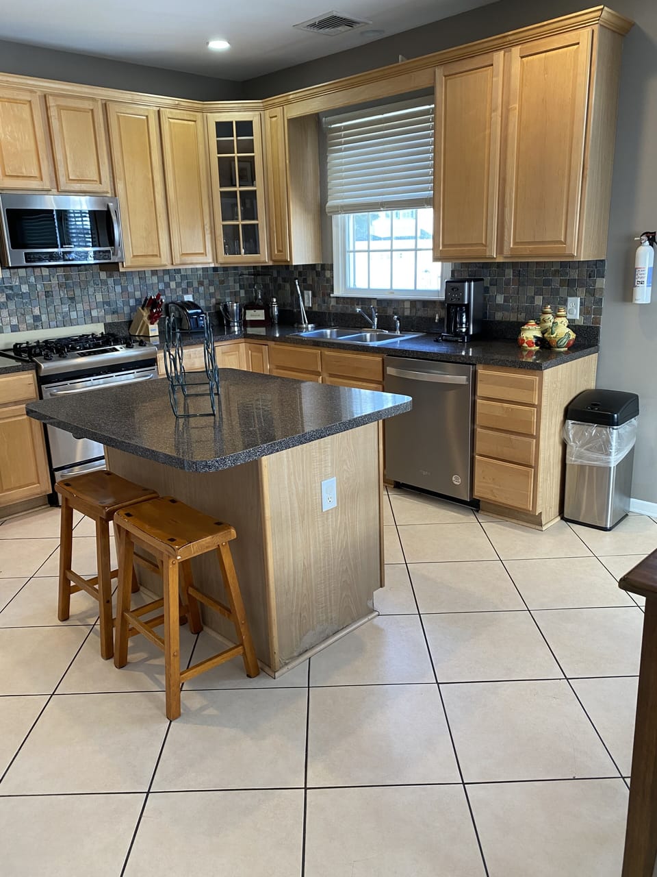 Spacious dine-in kitchen features updated stainless steel appliances