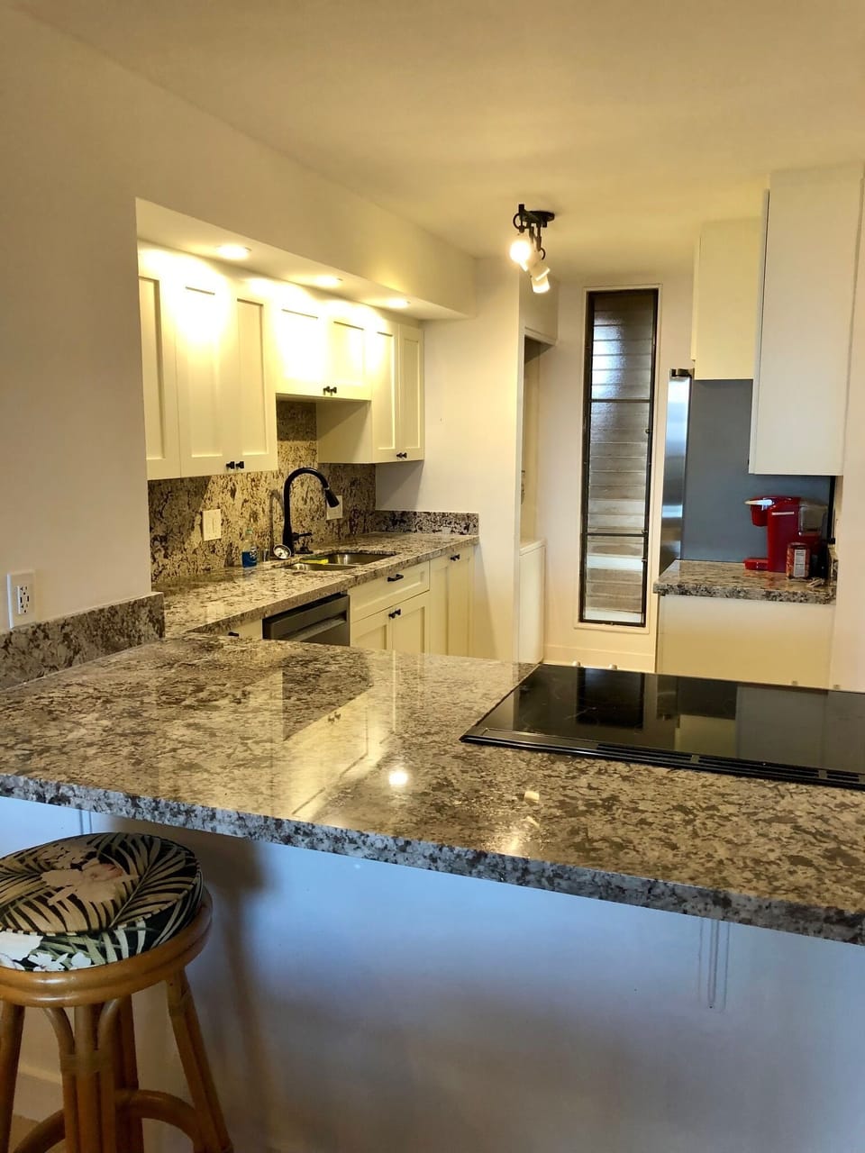 Newly remodeled kitchen with new cabinets, countertops, appliances, flooring