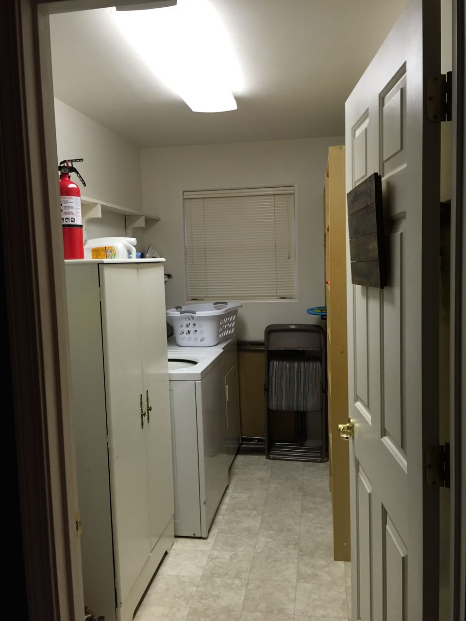 Laundry room with full size washer and dryer.