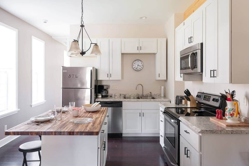 Fully stocked kitchen with island dining area