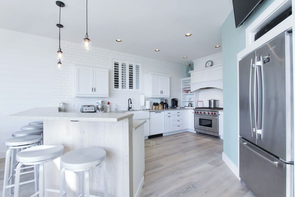 The large gourmet kitchen is bright and well-stocked!