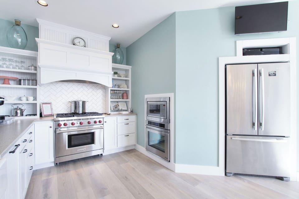 The professional kitchen features Wolf, Jenn-air, Miele, and Dacor appliances