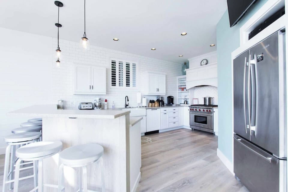 The large gourmet kitchen is bright and well-stocked!