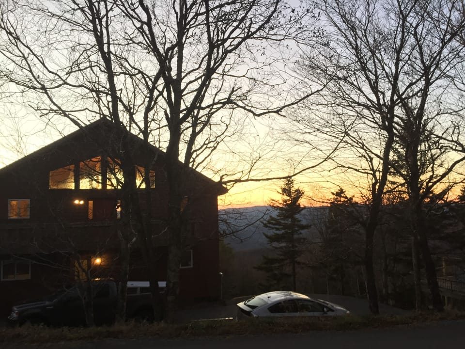 View of the house at sunset from West Ridge Road.
