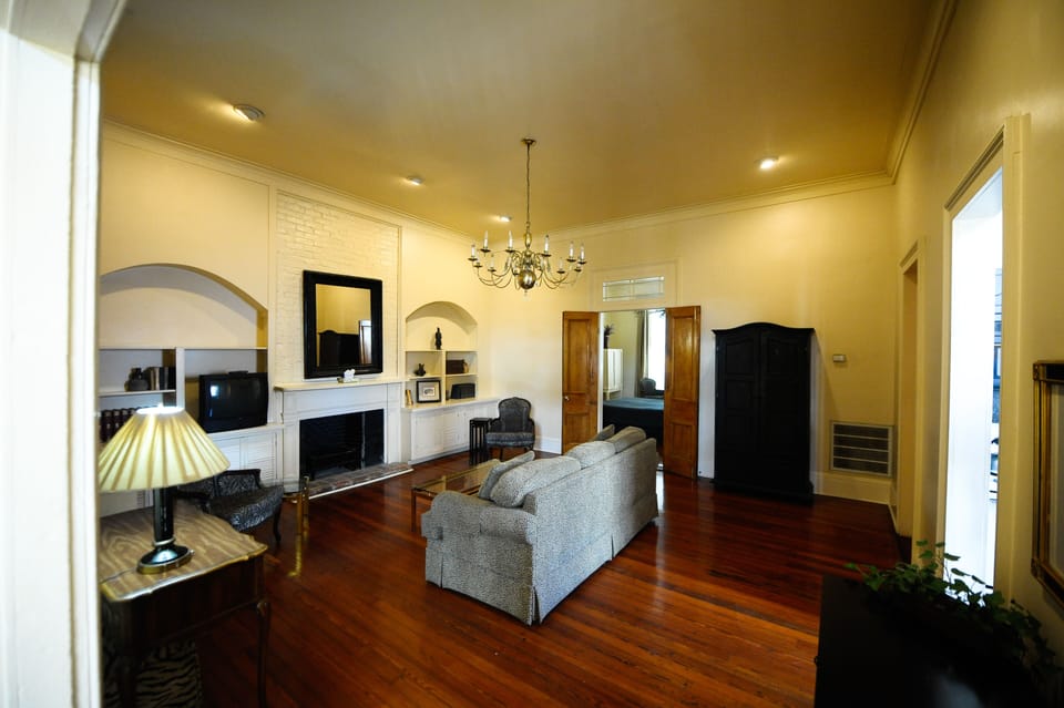 French doors separate living room from the bedroom