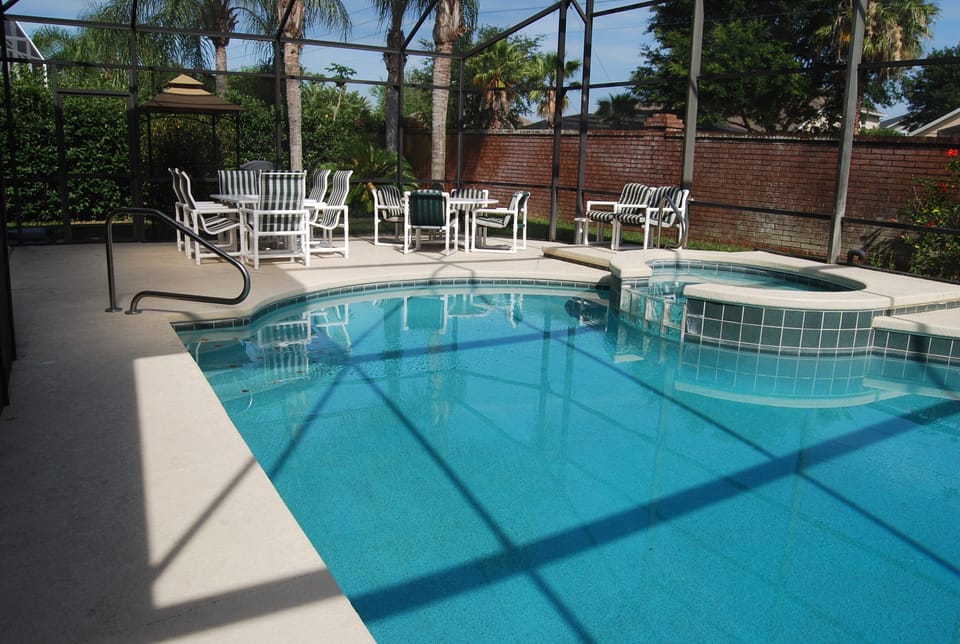 Plenty of seating at tables by the pool