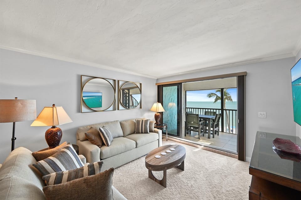 Living room, view to lanai, beach and gulf

