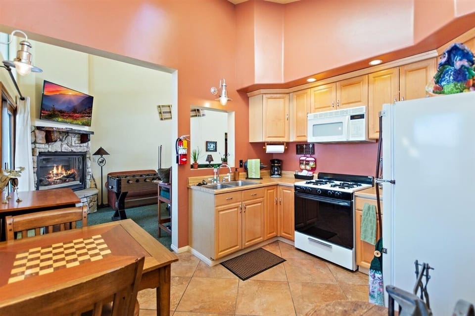 Upstairs Kitchen leading to the Game Room,  Yes, there are 2 Kitchens!!