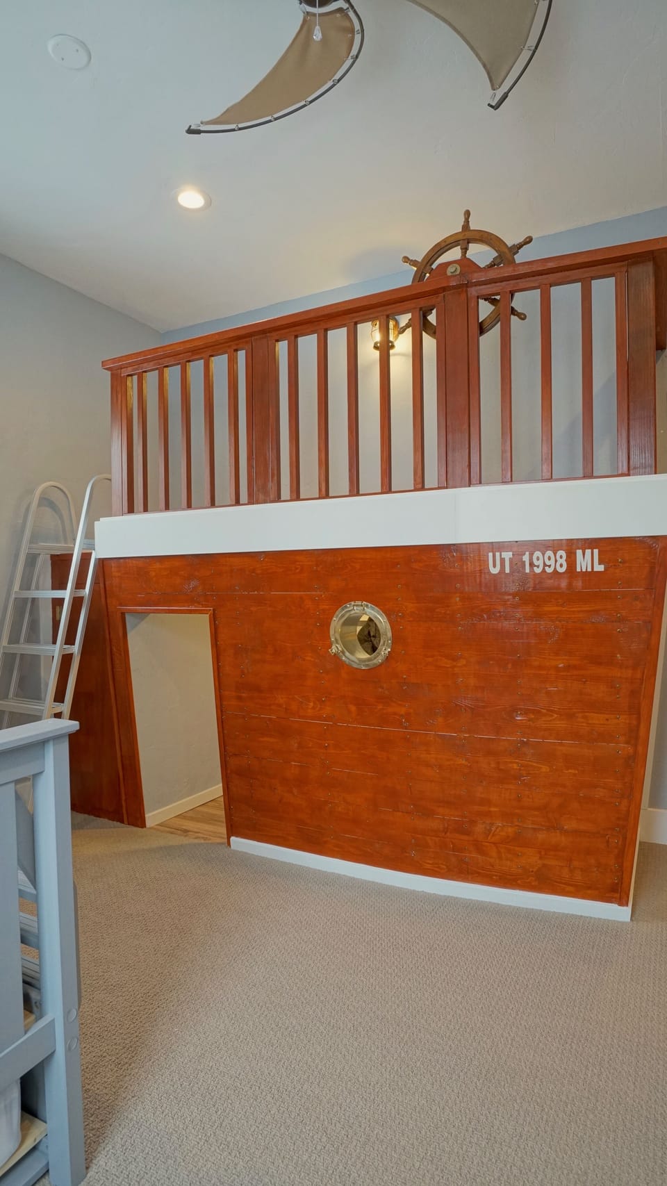 Securely enclosed deck with a working ship's wheel
