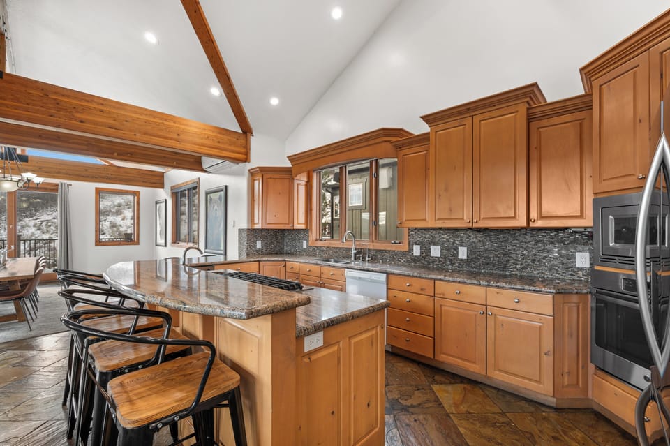 Gourmet kitchen is open to living room and dining 