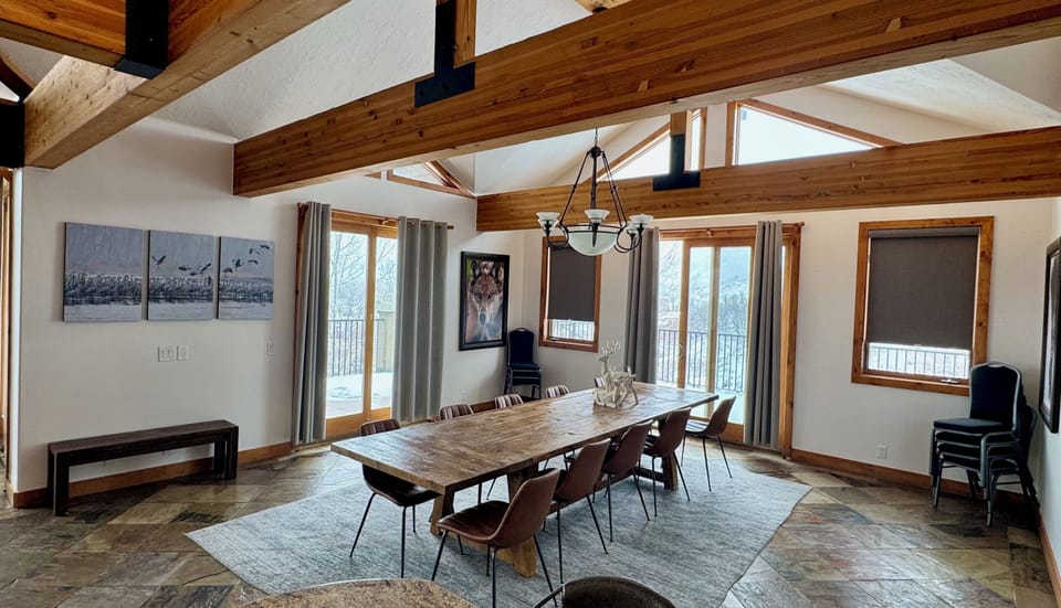 Large dining table and eating areas adjacent to main living area and kitchen