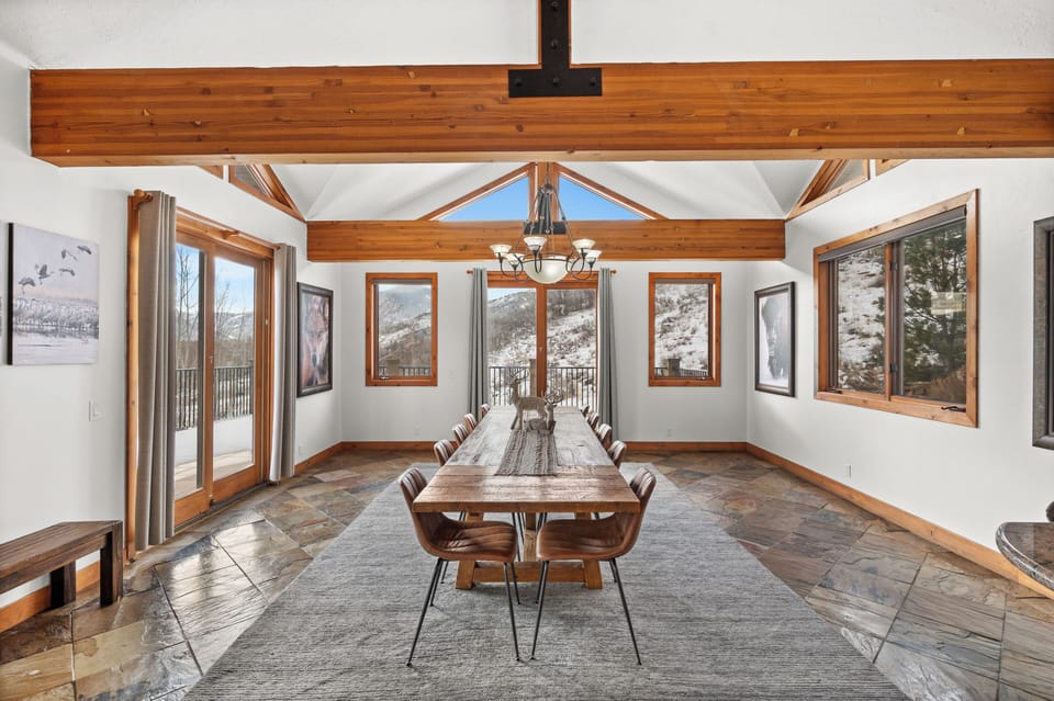 Large dining table and eating areas adjacent to main living area and kitchen