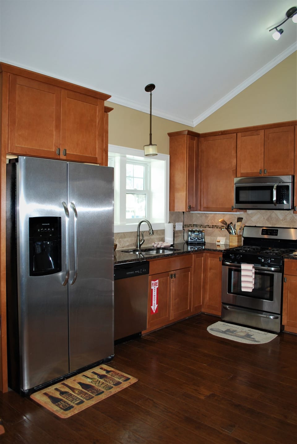 The fully equipped kitchen has stainless steel appliances. 