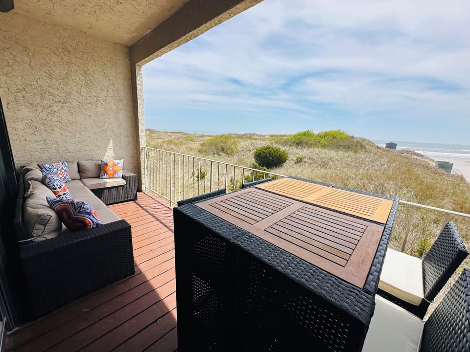 Sectional sofa and dining table off family room with direct oceanfront views!