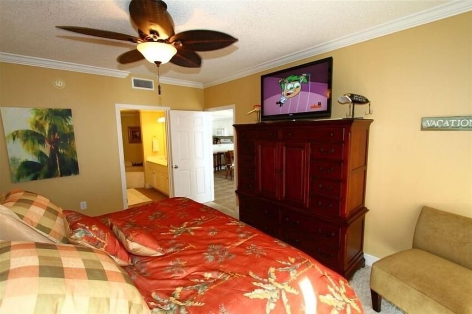 Large flat panel tv in the master bedroom.
