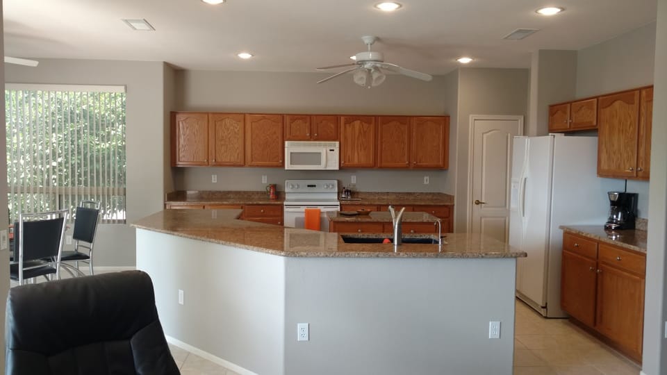 Open concept kitchen for entertaining with nook