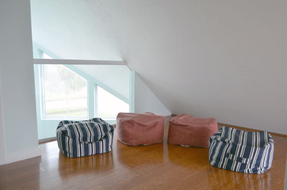 Upstairs loft area is perfect for the kids to relax, play board games or read.