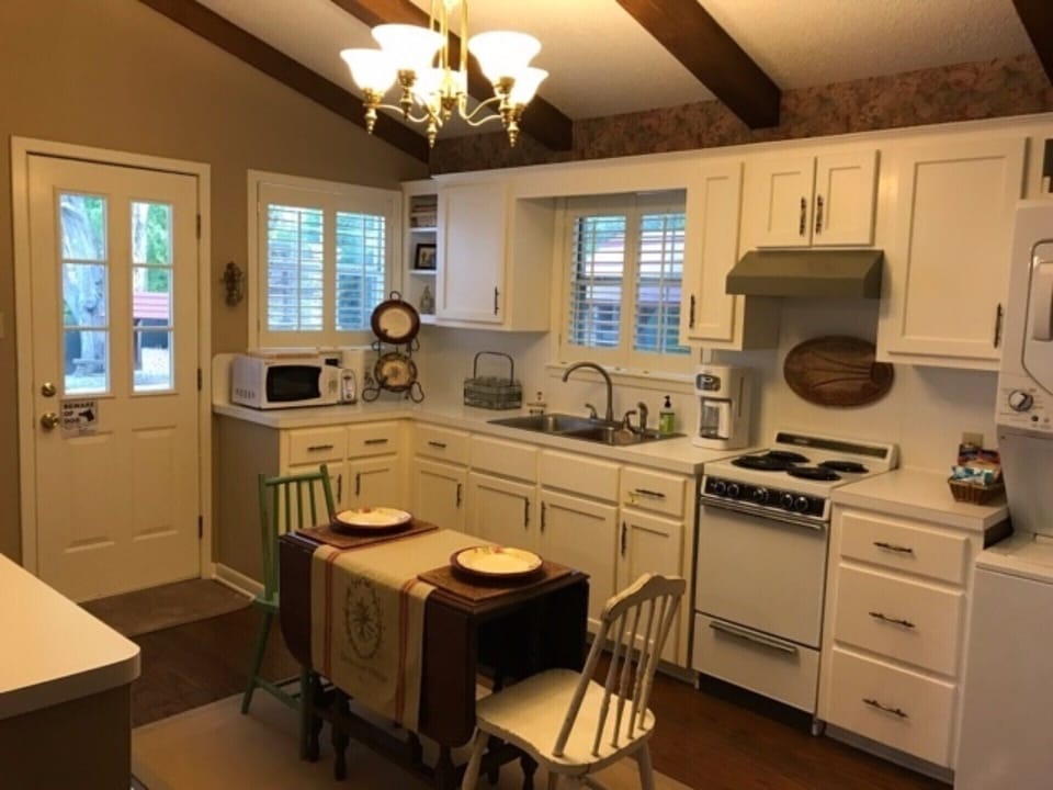 Kitchen dining table opens up to a four-top