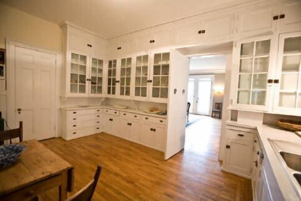 View from butler's kitchen into the dining room. Stocked with baking needs.