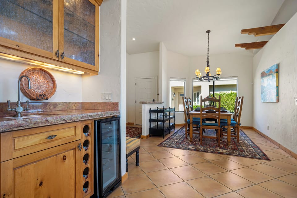 Stylish wet bar with cabinets perfect for mixing cocktails or evening toast