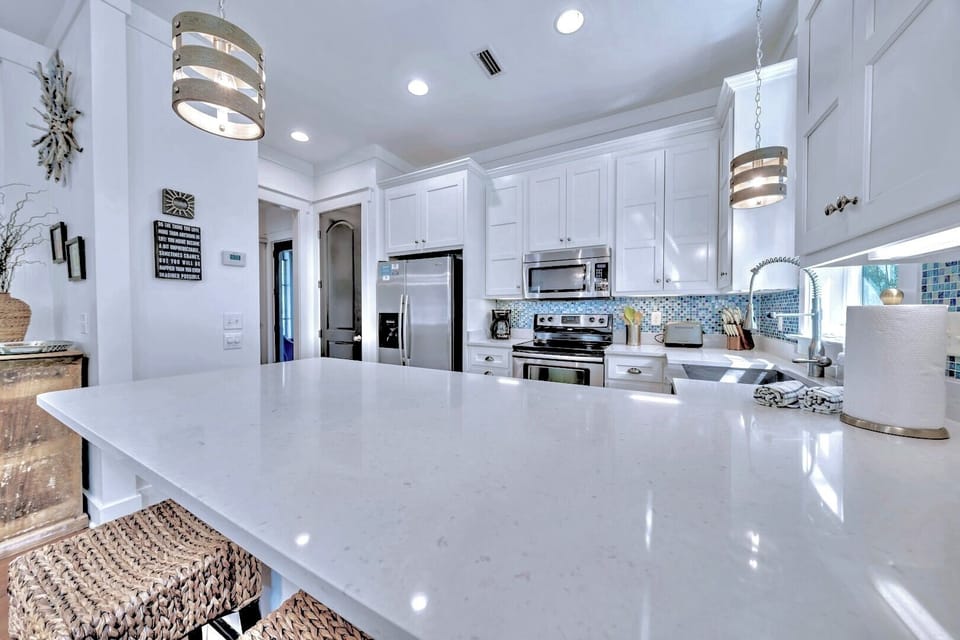 Bright kitchen open to seating & entertainment area