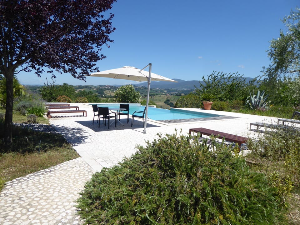 Pool plenty of sunbeds & cushions, three sun umbrellas, and shade from two trees