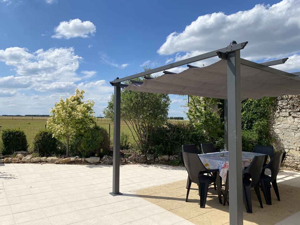 Patio with gazebo, outdoor table & 6 chairs